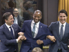 Conservative Leader Pierre Poilievre and Prime Minister Justin Trudeau drag Greg Fergus to the Speaker's chair