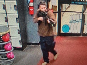 This handout image released on October 25, 2023 by the Androscoggin County Sheriff's Office via Facebook shows a photo of the armed suspect in a shooting as law enforcement in Androscoggin County investigate "two active shooter events" in Lewiston, Maine.