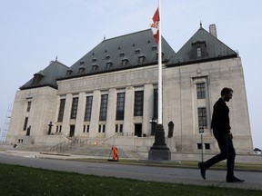 A man walks past the Supreme Court of Canada, Friday, June 16, 2023, in Ottawa.