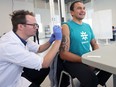 Premier Wab Kinew receives his flu shot