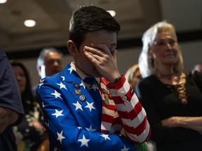 Reed Elliotte, 13, cries while Republican candidate for governor of Kentucky, Attorney General Daniel Cameron, gives his concession speech at the Republican watch party at the Marriott Hotel on Tuesday, Nov. 7, 2023, in Louisville, Ky. Incumbent Democrat Andy Beshear will serve a second term as governor of Kentucky.
