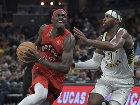 Toronto Raptors forward Pascal Siakam drives toward the basket against Indiana Pacers guard Buddy Hield (7) during the second half of an NBA basketball game Wednesday, Nov. 22, 2023, in Indianapolis.