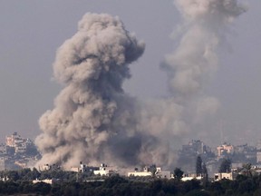 A picture taken from southern Israel on Wednesday, Nov. 1, 2023 shows smoke rising over buildings in the Gaza Strip during an Israeli strike, amid the ongoing battles between Israel and the Palestinian group Hamas.