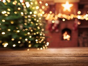 Christmas Tree With Illumination Near the Fireplace. Home Decor