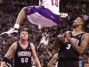 VINCE CARTER SCORES PAST SHAREEF ADBUR-RAHIM AND BRYANT REEVES BACK IN THE DAY.