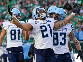 They're only the second CFL team ever to register 16 wins in a season but head coach Ryan Dinwiddie and the Toronto Argonauts aren't done yet. Toronto Argonauts running back Daniel Adeboboye (21) celebrates with teammates after scoring a touchdown against Saskatchewan Roughriders during the second half of CFL football action in Regina, Saturday, Oct. 21, 2023.