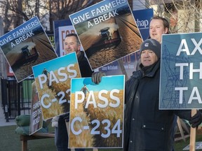 A handful of local farmers stood outside the office of Edmonton Centre MP Randy Boissonnault in Edmonton on Nov. 20, 2023 in support of Bill C-234 that would exempt farms from paying carbon tax on propane and natural gas.