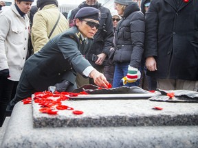 Thousands gathered at The National War Memorial for the Remembrance Day ceremony, Saturday, Nov. 11, 2023. After the ceremony people placed their poppies on the Tomb of the Unknown Soldier.
