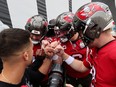 John Wolford #11, Baker Mayfield #6 and Kyle Trask #2 of the Tampa Bay Buccaneers huddle before warmups prior to the game against the Jacksonville Jaguars.