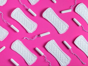 Tampons, feminine sanitary pads pattern on pink background. Hygiene care during critical days. Menstrual cycle.