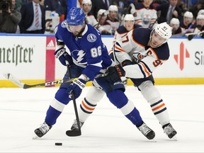 Neither Oilers’ Connor McDavid (right) nor fellow superstar Nikita Kucherov of the Lightning would be in the NHL playoffs if the season were to end tonight.