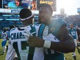 DJ Chark Jr. of the Carolina Panthers and Josh Allen of the Jacksonville Jaguars hug after Jacksonville's 26-0 win at EverBank Stadium on Dec. 31, 2023 in Jacksonville, Fla.