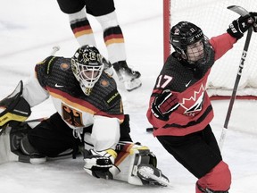 Canada's Macklin Celebrini (17) scores on Germany goaltender Matthias Bittner (1) during first period hockey action at the IIHF World Junior Hockey Championship in Gothenburg, Sweden, Sunday, Dec. 31, 2023.