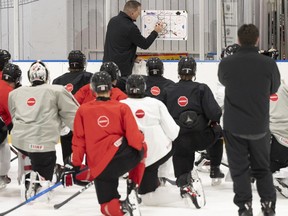 Canada assistant coach Gilles Bouchard goes over plays during a practice session at the World Junior Hockey Championship in Gothenburg, Sweden, on Saturday, Dec. 30, 2023.