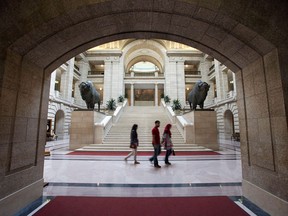 Visitors walk past the Grand Staircase at the Manitoba Legislature in Winnipeg, Saturday, August 30, 2014. The Manitoba government is set to receive a major boost in federal equalization payments next year.