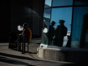 Manitoba is preparing to join other provinces and increase taxation of vaping products next year, as a way to discourage use of the products, especially among young people. A passenger exhales while vaping at Vancouver International Airport, in Richmond, B.C., Friday, Dec. 8, 2023.