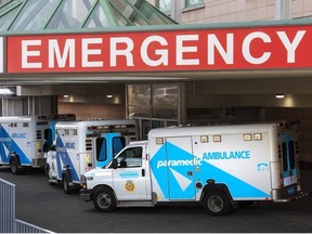 A paramedic closes the doors of an ambulance at a hospital in Toronto on Tuesday, April 6, 2021.