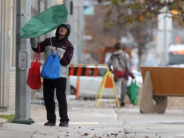 A person with an umbrella that caught a gust of wind in Winnipeg. Chris Procaylo, Friday, October 06, 2023 Winnipeg Sun