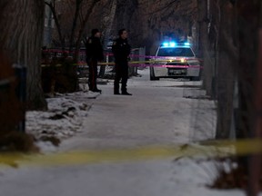 Winnipeg police officers at a secured scene