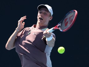 Denis Shapovalov of Canada plays a forehand in their round one singles match against Jakub Mensik of the Czech Republic.