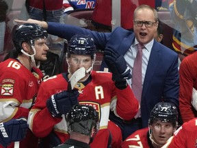 Florida Panthers head coach Paul Maurice talks with an official during a game.