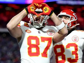 Travis Kelce (87) of the Kansas City Chiefs celebrates after scoring a 22-yard touchdown against the Buffalo Bills during the second quarter in a AFC divisional round playoff game at Highmark Stadium on Sunday, Jan. 21, 2024, in Orchard Park, N.Y.