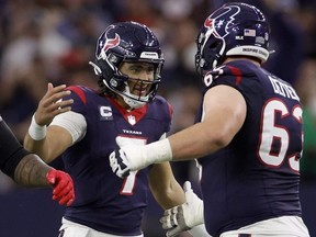 Texans quarterback C.J. Stroud, left, celebrates with Michael Deiter, right, after a touchdown against the Browns during the second quarter in the AFC Wild Card Playoffs at NRG Stadium in Houston, Saturday, Jan. 13, 2024.