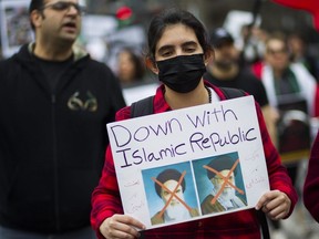People take part in a rally in Montreal against Iran's Islamic Revolutionary Guard Corps (IRGC), April 29, 2023.
