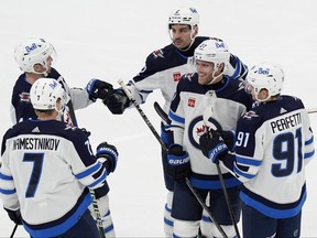 The Winnipeg Jets celebrate a goal during the first period against the Boston Bruins, Monday, Jan. 22, 2024, in Boston.