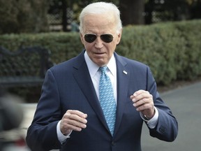 U.S. President Joe Biden answers questions while departing the White House in Washington, D.C., Tuesday, Jan. 30, 2024.