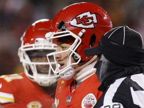 Chiefs quarterback Patrick Mahomes heads to the sideline after his helmet was cracked during the third quarter in the AFC Wild Card Playoffs against the Miami Dolphins at GEHA Field at Arrowhead Stadium in Kansas City, Mo., Saturday, Jan. 13, 2024.