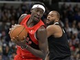 Toronto Raptors forward Pascal Siakam works against Memphis Grizzlies forward Xavier Tillman during the first half of an NBA basketball game Wednesday, Jan. 3, 2024, in Memphis, Tenn.