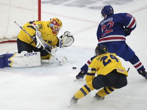 Team USA's Isaac Howard (22) scores on Sweden goaltender Hugo Havelid (35) as Tom Willander (24) defends during second period gold medal hockey action at the IIHF World Junior Hockey Championship in Gothenburg, Sweden, Friday, Jan. 5, 2024.