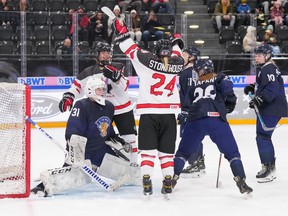 Canada's Abby Stonehouse celebrates with teammate Sienna D'Allessandro after scoring against Finland during bronze-medal game action at the U18 Women's World Championship on Sunday January 14, 2024 in Zug, Switzerland.