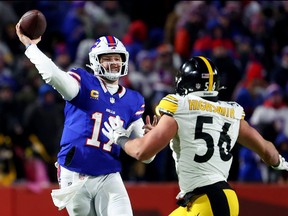 Josh Allen of the Buffalo Bills passes against Alex Highsmith #56 of the Pittsburgh Steelers during the third quarter at Highmark Stadium on Jan. 15, 2024 in Orchard Park, N.Y.