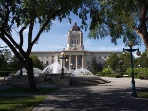 A former Manitoba Progressive Conservative cabinet minister is denying accusations by two former colleagues that he tried to rush approval of a proposed mining project. The Manitoba Legislature in Winnipeg, Saturday, August 30, 2014.