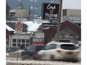 The sign in front of The Cork + Flame on Portage Avenue