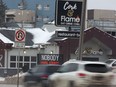 The sign in front of The Cork + Flame on Portage Avenue