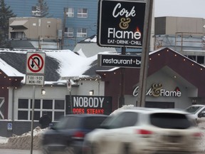 The sign in front of The Cork + Flame on Portage Avenue