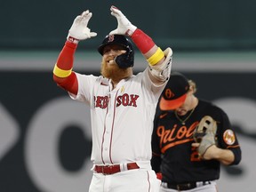 Justin Turner celebrates his RBI double with the Red Sox last year.