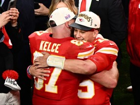 Kansas City Chiefs tight end Travis Kelce (87) and quarterback Patrick Mahomes (15) hug after winning Super Bowl LVIII against the San Francisco 49ers at Allegiant Stadium in Las Vegas, Nev., on Sunday, Feb. 11, 2024.