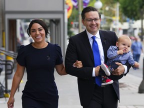 Conservative leader Pierre Poilievre and his wife, Anaida, and son Cruz arrive at the Conservative caucus meeting in Ottawa on Sept. 12, 2022.