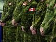 Canadian Forces personnel stand easy during a government event at CFB Kingston in Kingston, Ont., Tuesday, March 7, 2023.