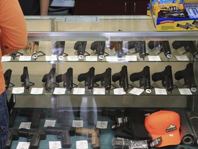 Handguns are displayed at a gun shop on June 23, 2022, in Honolulu.