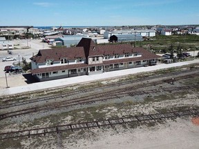 The federal and Manitoba governments are putting another $60 million into a railway and port in the province's north. An aerial view of the rail line and Via station is shown in Churchill, Man., on July 4, 2018.