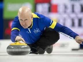 Team Alberta skip Kevin Koe makes a shot against Team NWT at the 2023 Tim Hortons Brier in London, Ontario on Thursday March 9, 2023.&ampnbsp;Alberta's Aaron Sluchinski, Manitoba's Reid Carruthers and wild-card Kevin Koe completed the 18-team field for the national men's curling championship Sunday.