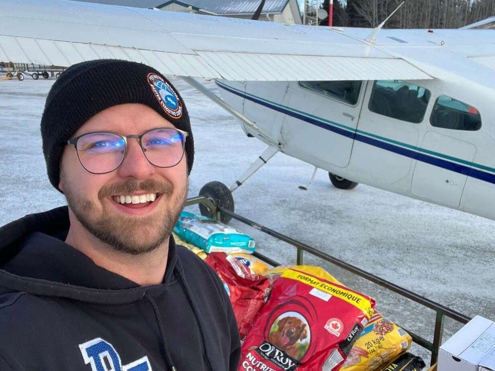 Volunteers flyin food for pets, strays into remote site for winter