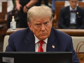 Former U.S. president Donald Trump sits inside the courtroom for the third day of his civil fraud trial in New York on Oct. 4, 2023.