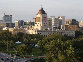 A consultant's report says the former Progressive Conservative government in Manitoba presented an incomplete picture of the province's financial challenges in the months leading up to the Oct. 3 election. The Manitoba legislature is seen in Winnipeg, Saturday, Aug. 30, 2014.