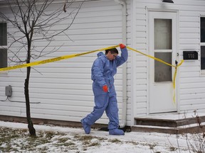 A forensic investigator is on the scene of an ongoing investigation regarding five deaths in southern Manitoba, in Carman, Man., Monday, Feb. 12, 2024. A mother, her three young children, including a two-month-old daughter, and a teenage family member killed in Manitoba are being remembered as beautiful souls. THE&ampnbsp;CANADIAN PRESS/David Lipnowski